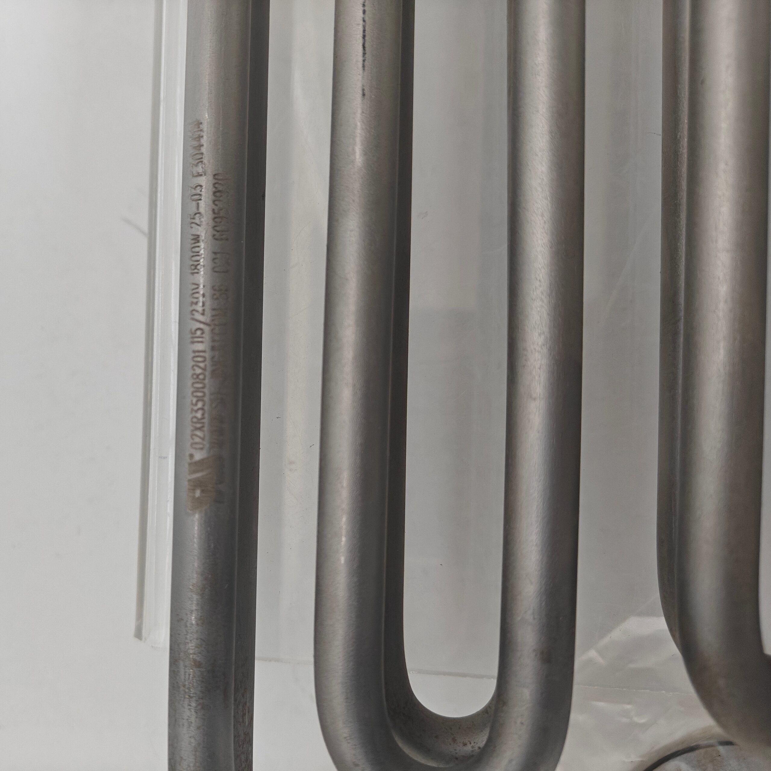 Carrier 02XR05001501 electric heating element for 19XR centrifugal chiller crankcase oil heater; stainless steel construction.